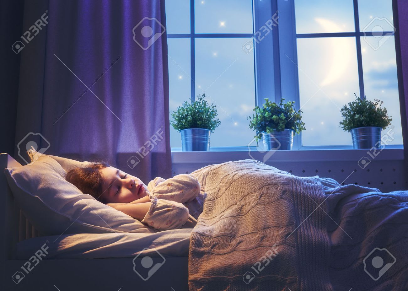 how many hours of sleep for children — young girl sleeping peacefully in bed at night