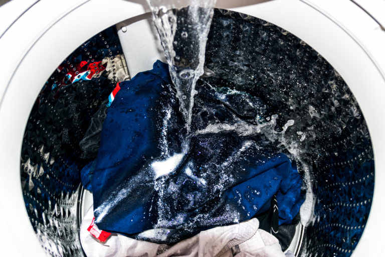 A washing machine running a cold water cycle to save energy on daily laundry