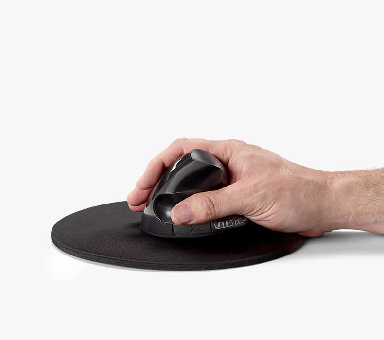 Right hand using a vertical ergonomic mouse in a natural handshake position on a mouse pad