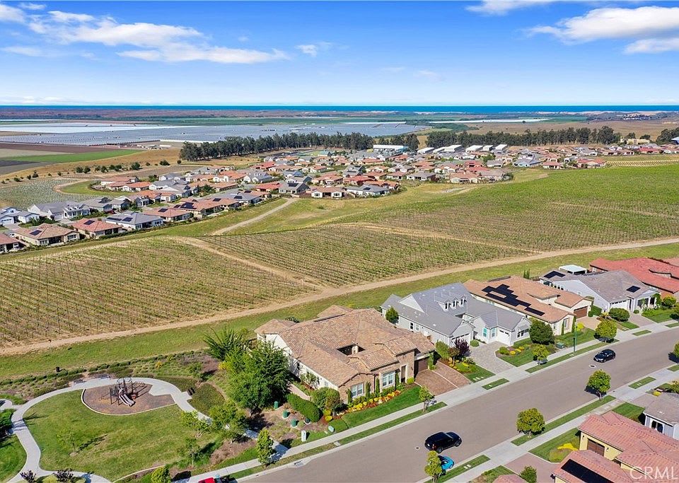 Aerial view of a Nipomo neighborhood with homes, roads, and fields
