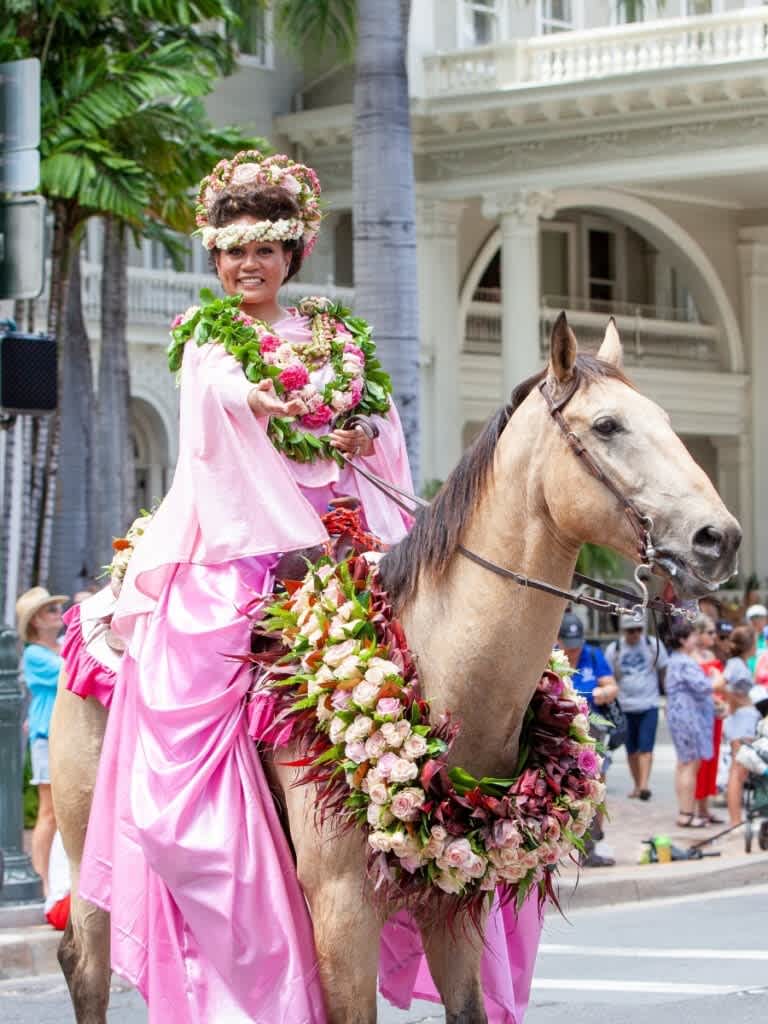 Parade rider with leis Waikiki