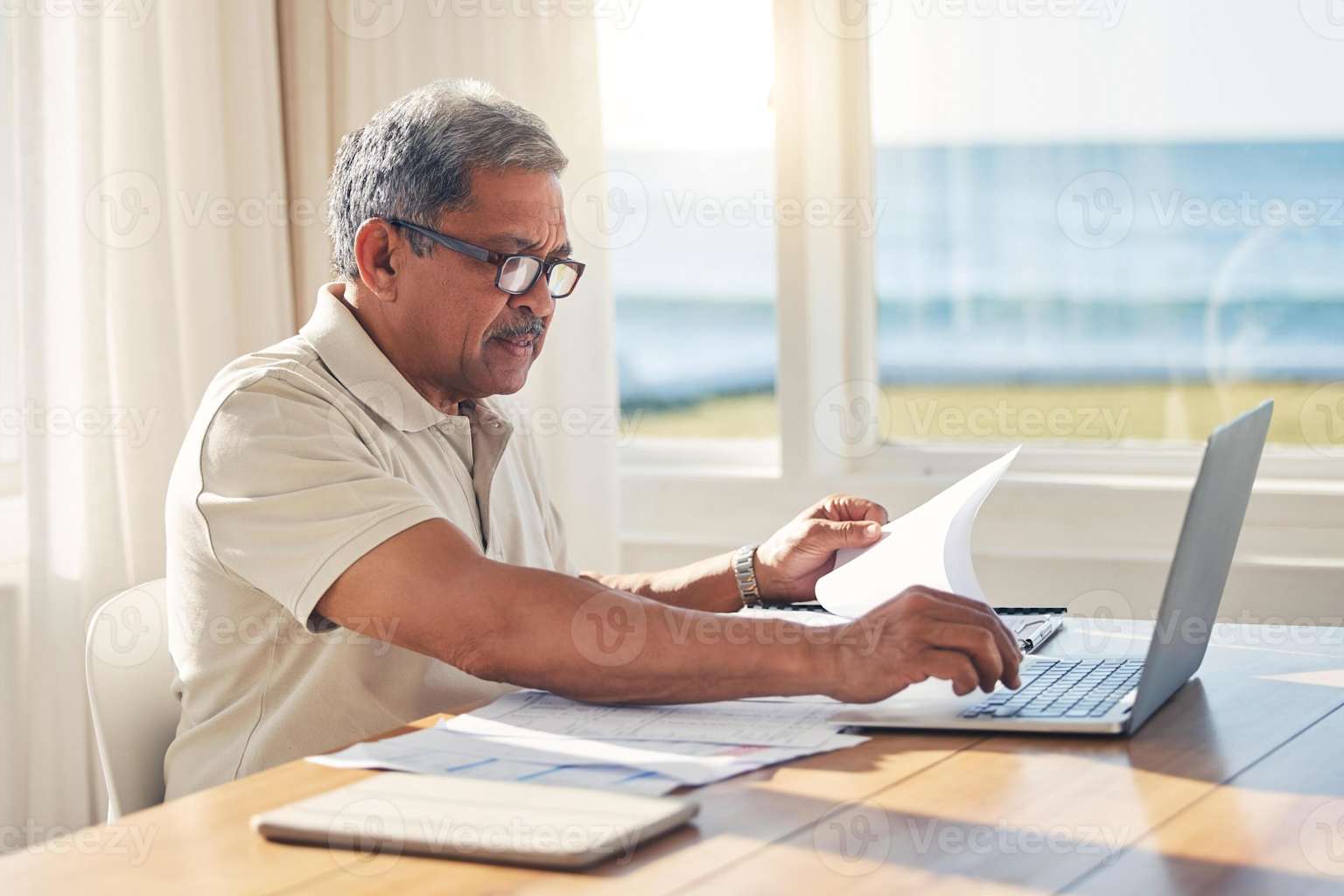 Retirement planning documents and laptop