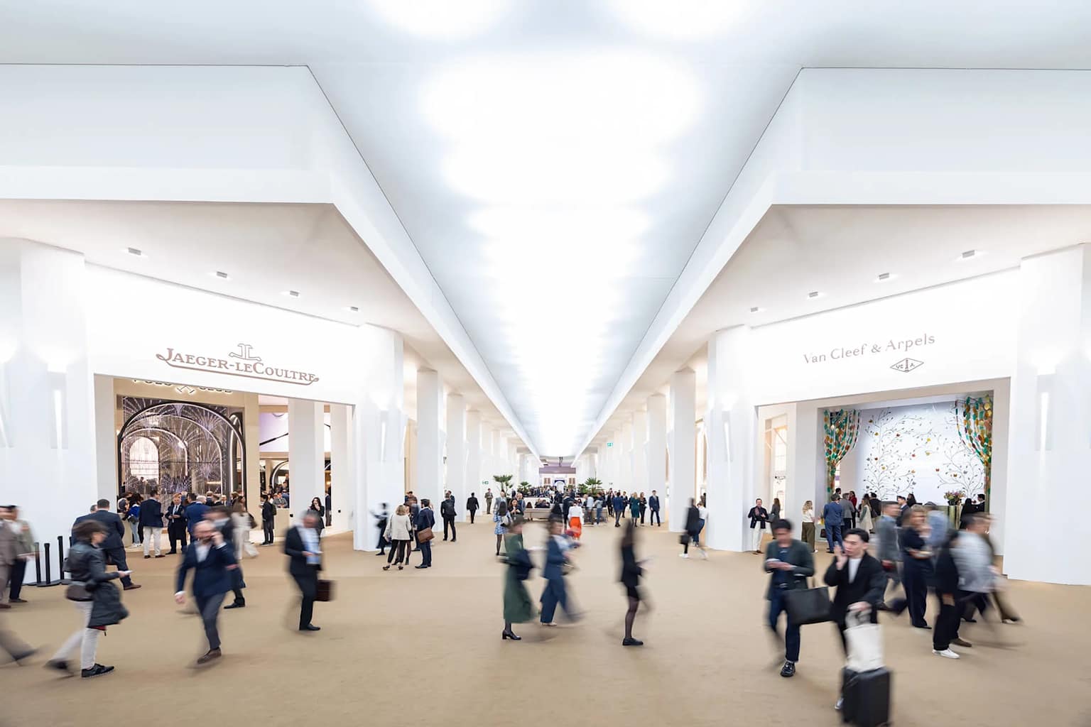 Main aisle of Watches and Wonders Geneva with luxury brand boutiques