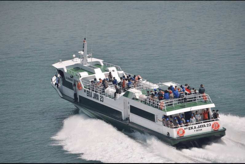 Pancasari Express public ferry crowded with passengers traveling between Bali and Lombok