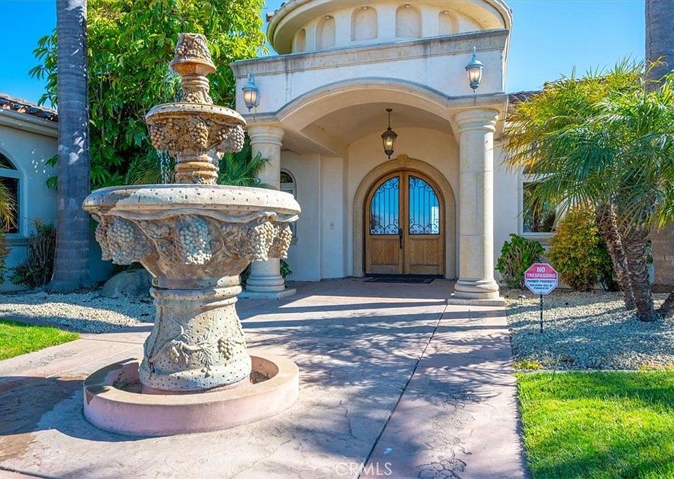 Luxury home exterior in Nipomo, California with landscaped entry and upscale curb appeal