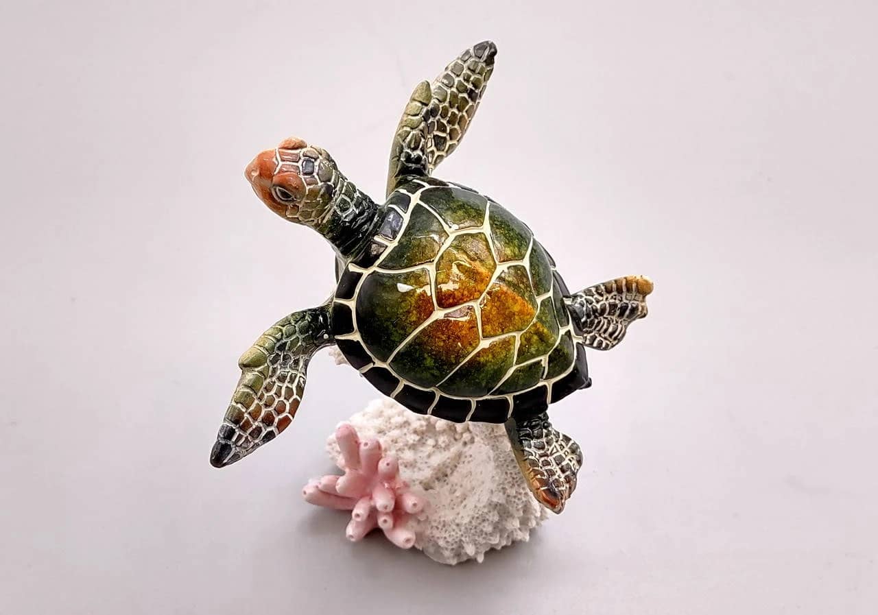 Yellow polystone turtle figurine with textured shell