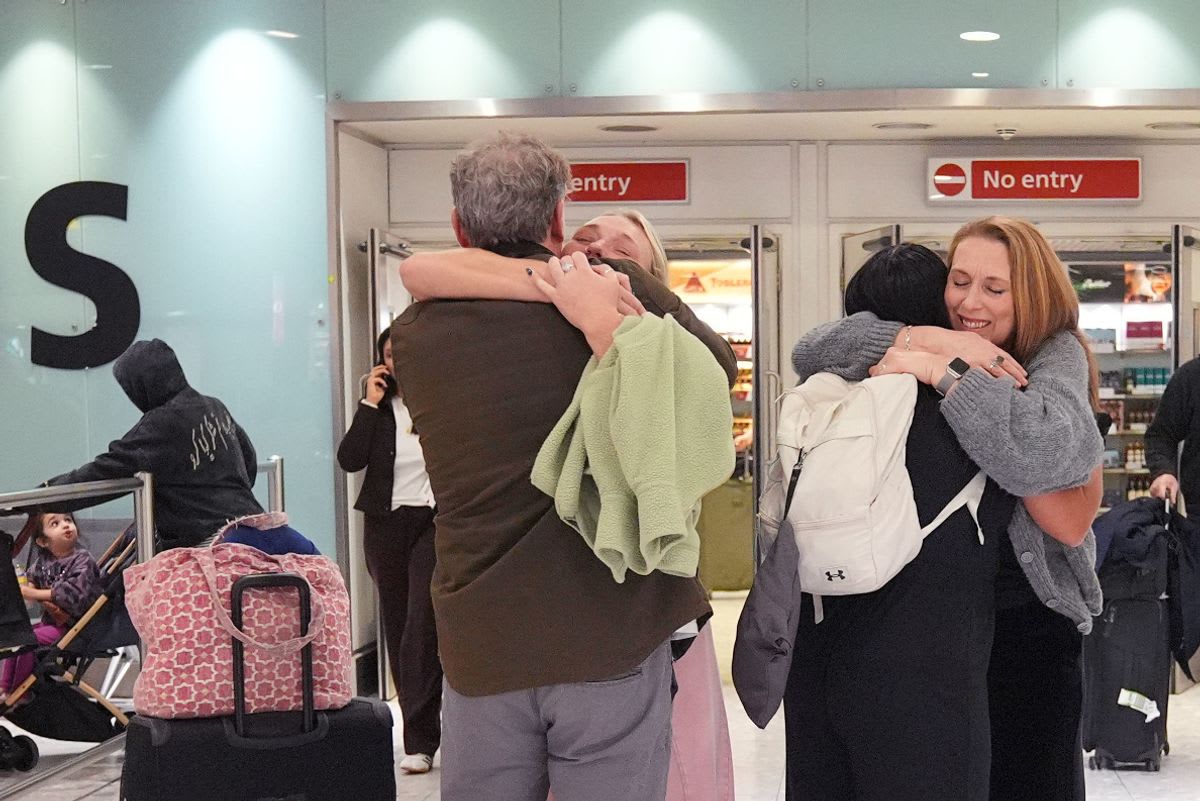 NGO team members at airport terminal during evacuation