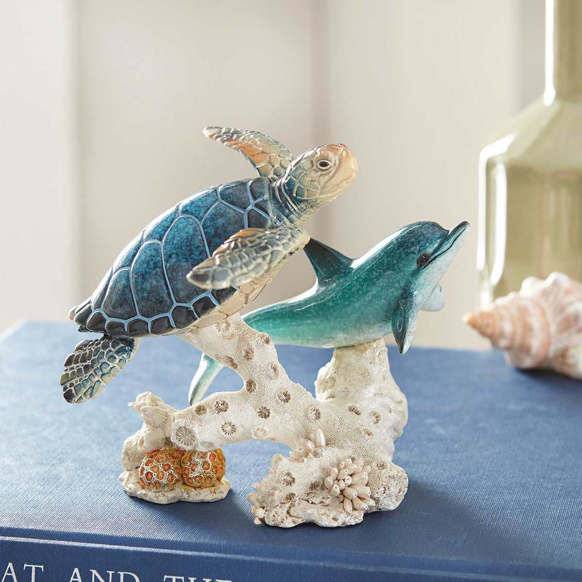Lacquer finish dolphin and turtles sculpture