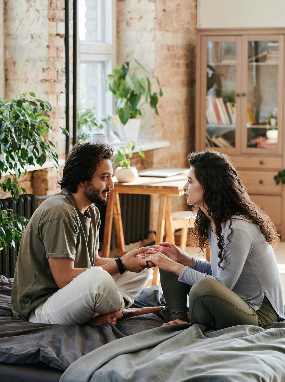 Couple talking closely at home