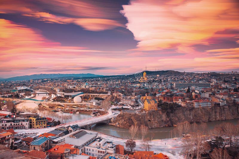 Tbilisi, Georgia skyline at dusk with dramatic clouds — seat of the India-GCC-Geo Business Council