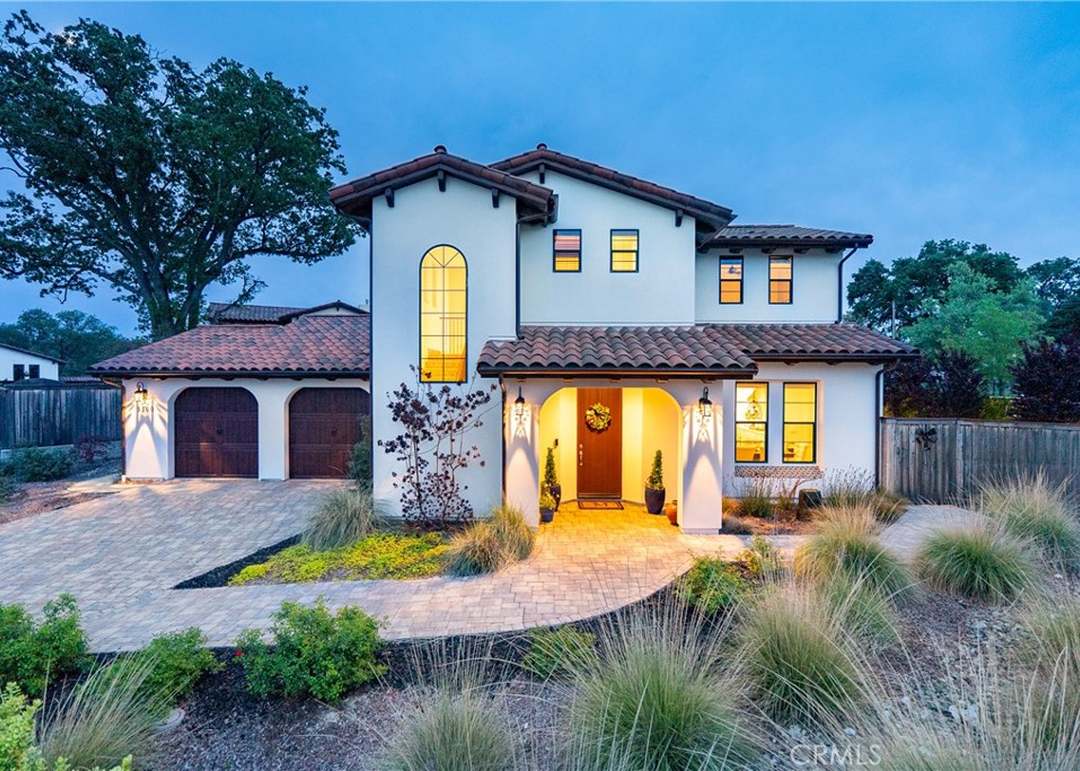 Atascadero home at dusk with driveway and garage