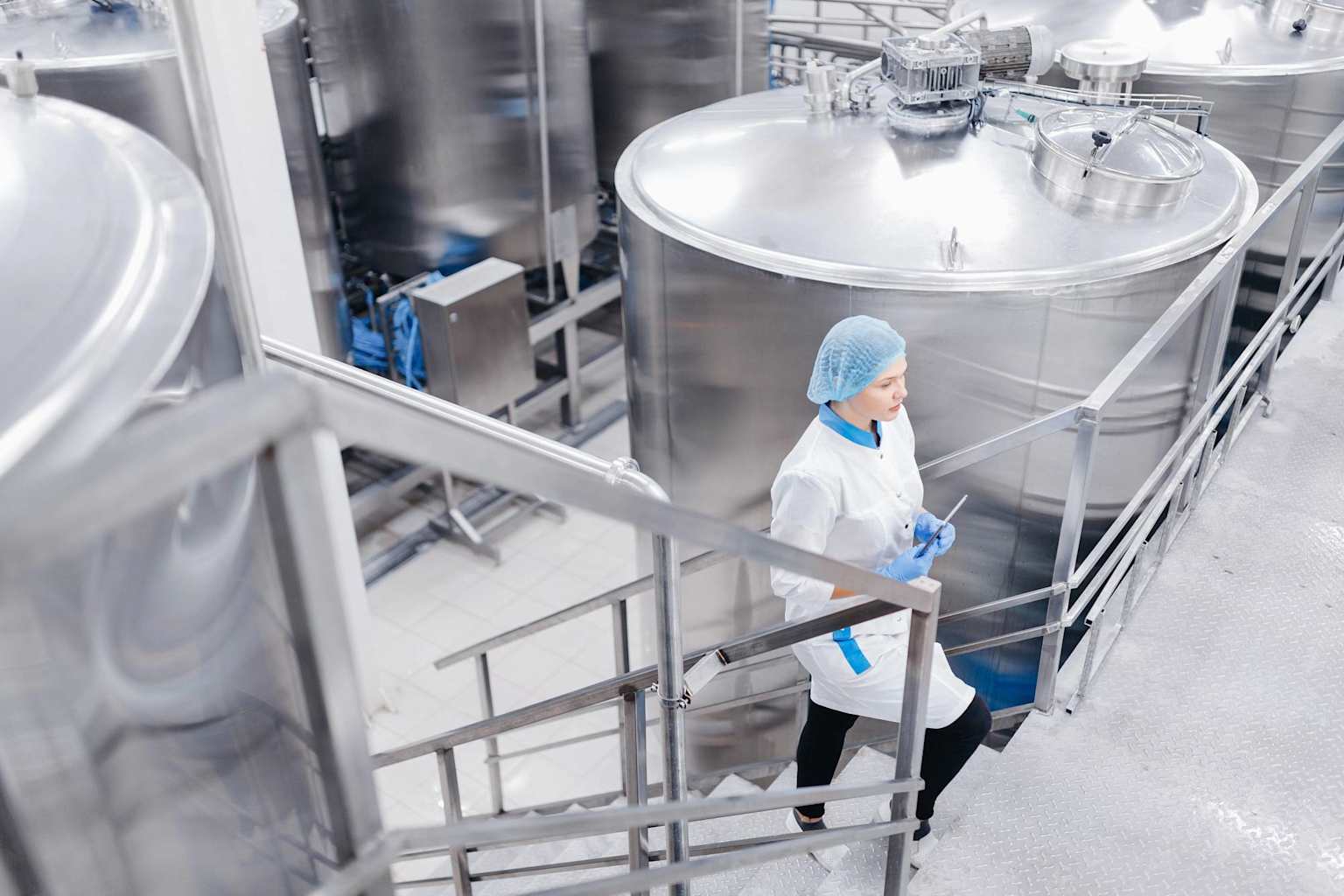 Food processing plant worker in clean facility