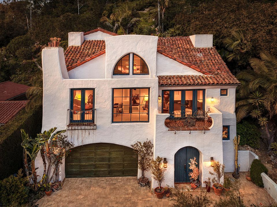 Santa Barbara hillside home with Spanish-style architecture at dusk