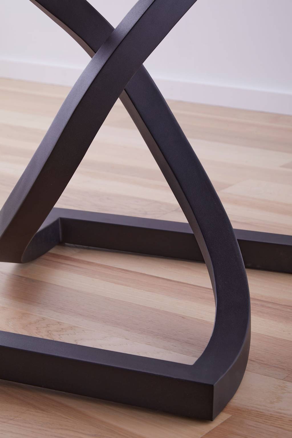 Black X-shaped metal legs