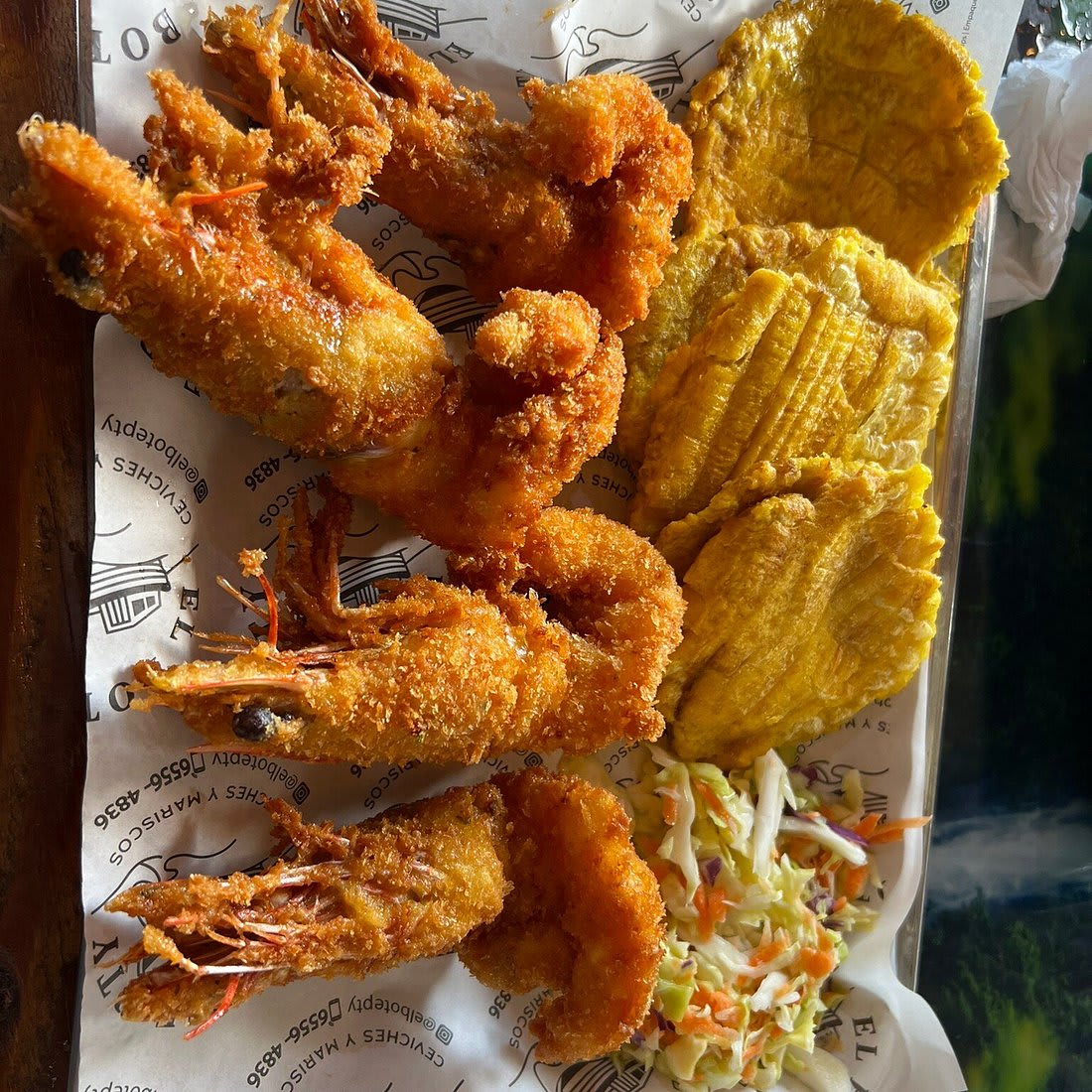 Fried seafood plate with patacones Mercado de Mariscos