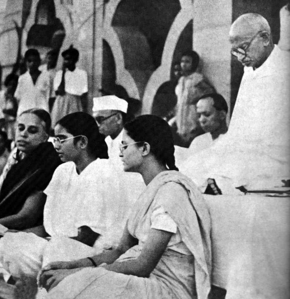 Gandhi seated at a prayer meeting in Delhi, November 1947, during the post-Partition period.