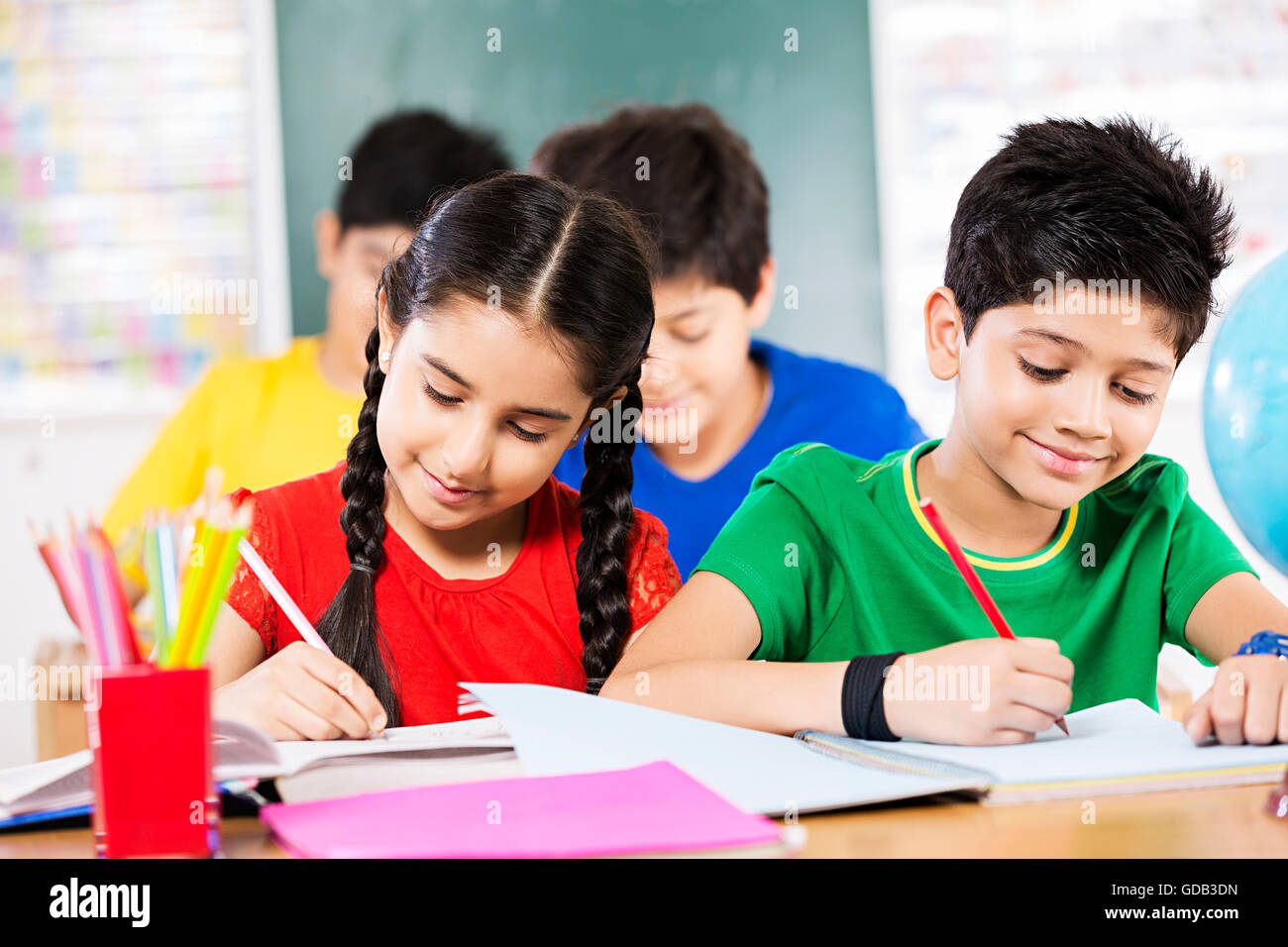 Young children studying together in a colorful classroom