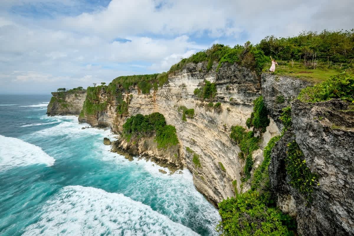 Sunset over dramatic Uluwatu cliffs in south Bali