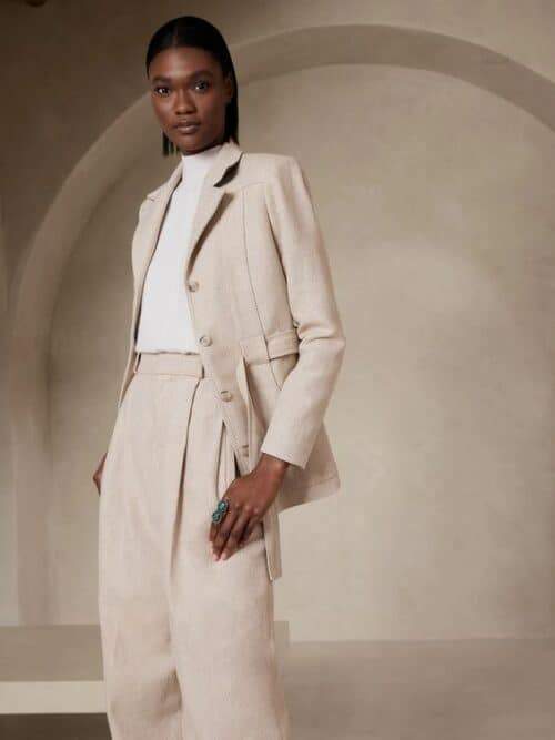 Tailored beige suit with wide-leg trousers in a quiet luxury style