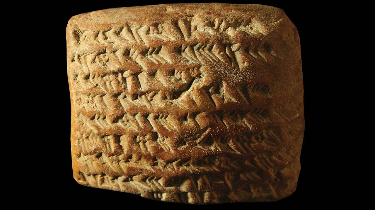 Old Babylonian clay tablet with cuneiform script used for astronomical or mathematical calculations — Babylonian math system base-60 sexagesimal