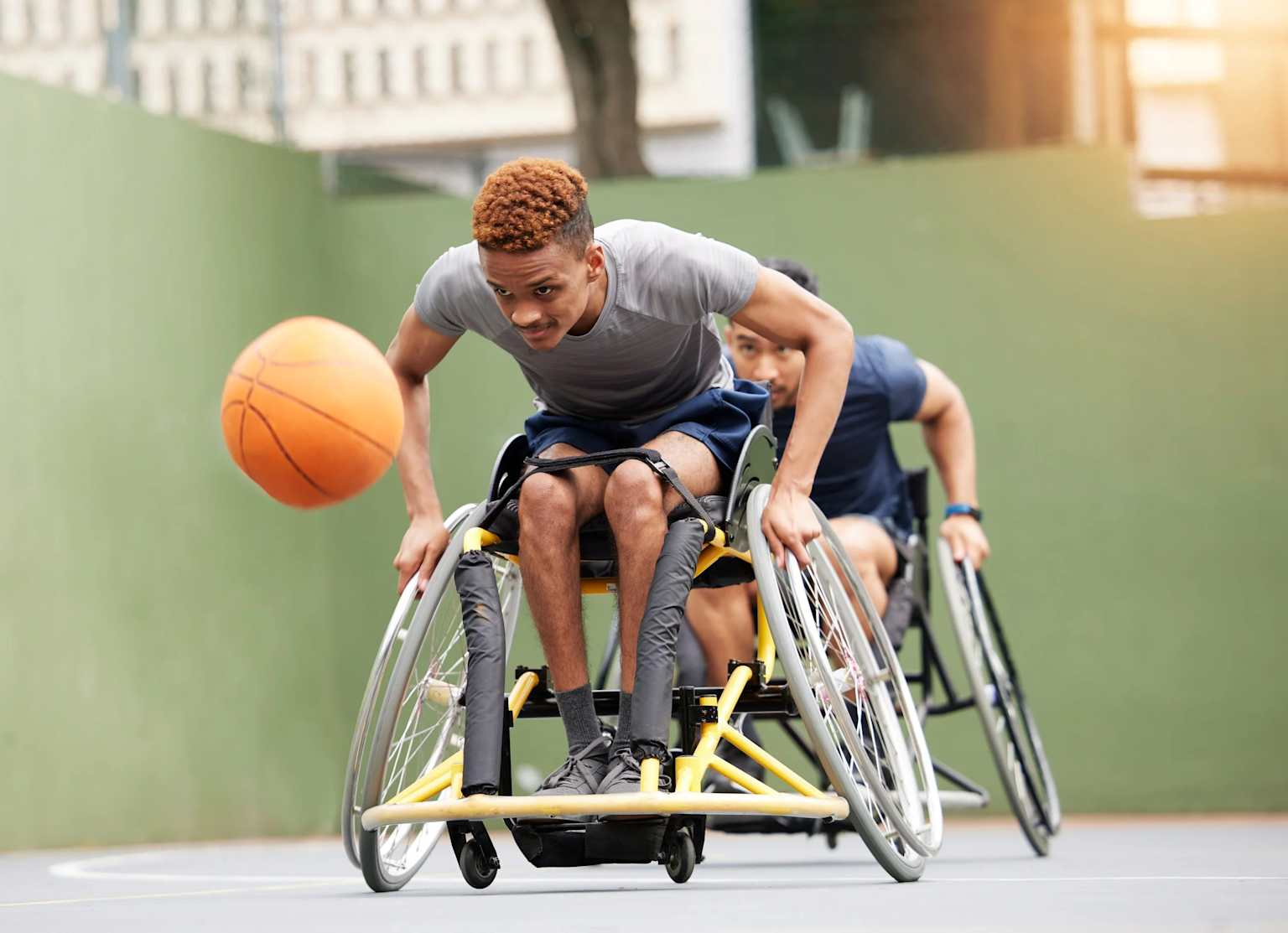 Adaptive sports athlete playing wheelchair basketball