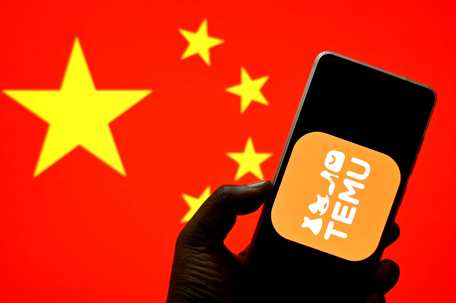 In this photo illustration, a Temu logo is seen displayed on...