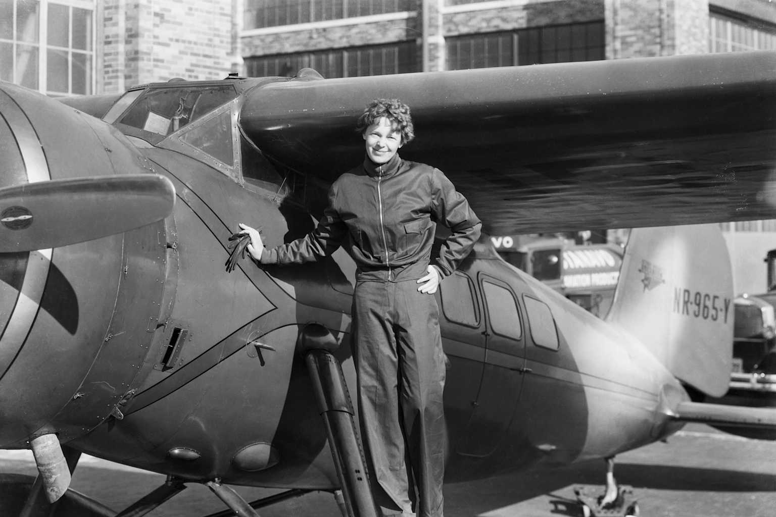 Amelia Earhart Next to Aircraft
