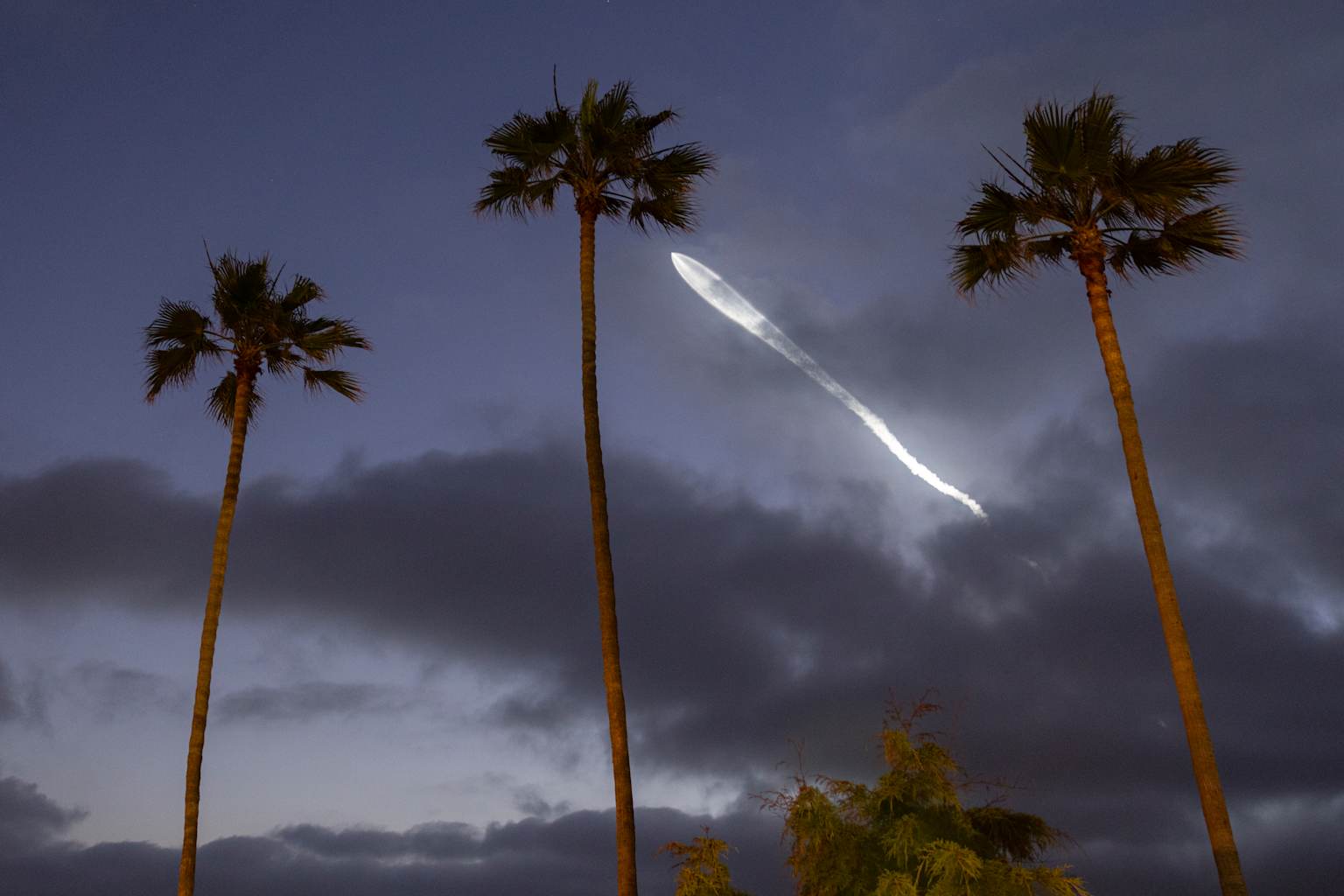 SpaceX Falcon 9 Rocket Launch At Sunset