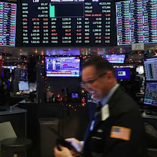 Trading floor of the New York Stock Exchange showing market data active during trading hours