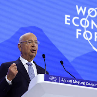 Speaker at the World Economic Forum Annual Meeting Davos 2025 addressing attendees from the podium