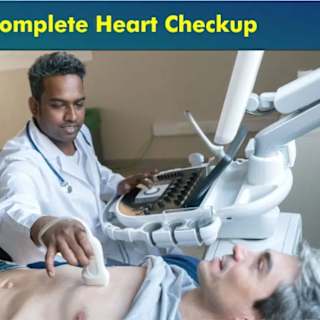 Doctor performing a complete heart ultrasound checkup on a patient in a medical setting