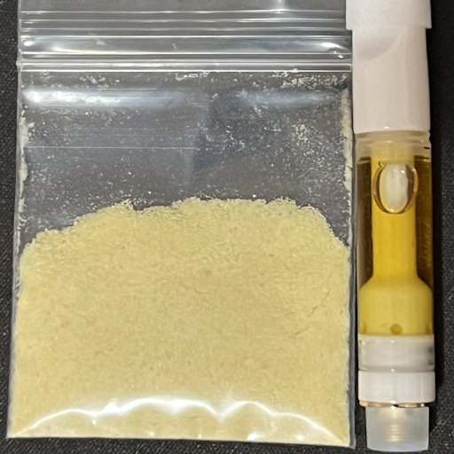 Comparison of N,N-Dimethyltryptamine (DMT) forms: freebase powder from *Mimosa hostilis* root bark and liquid extract in a vape cartridge.