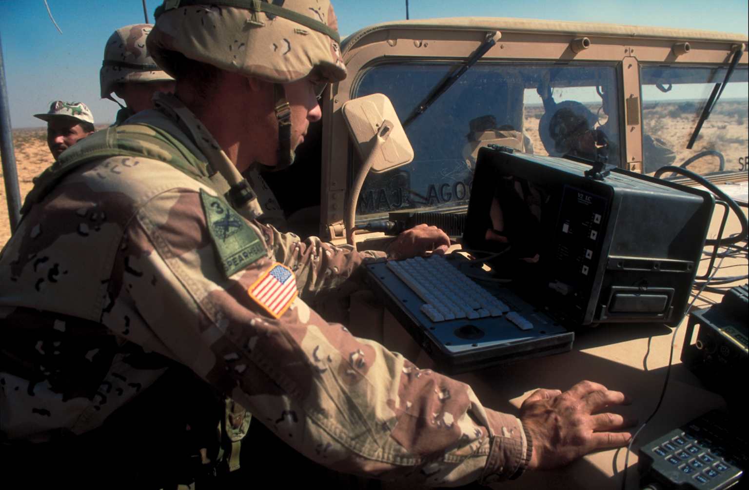 US Army soldier using computer set up in