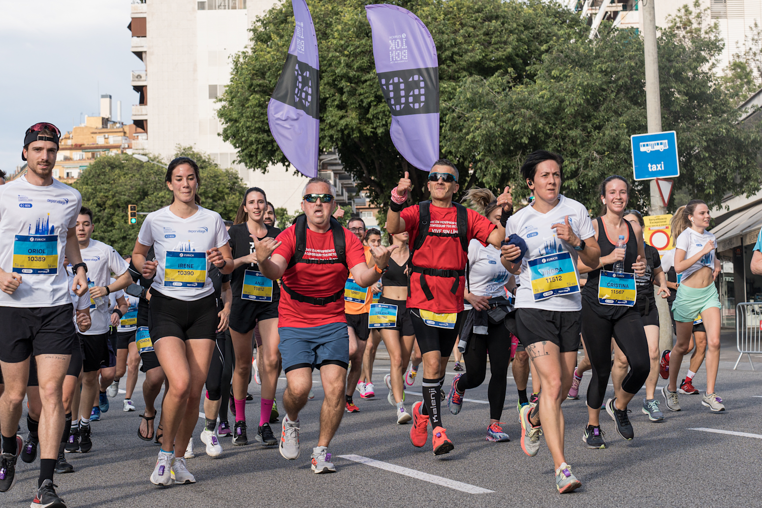 Runners seen on a street of the marathon route next to the...