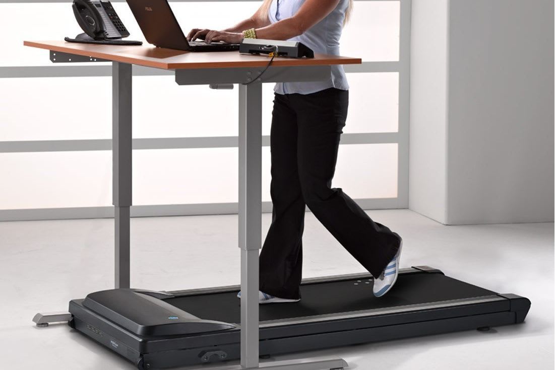 A treadmill desk, used to promote workplace fitness.
