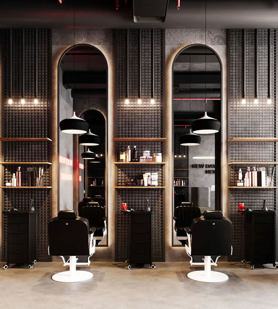 A clean and modern barbershop interior with multiple styling stations, showcasing an environment that promotes professionalism and client comfort.