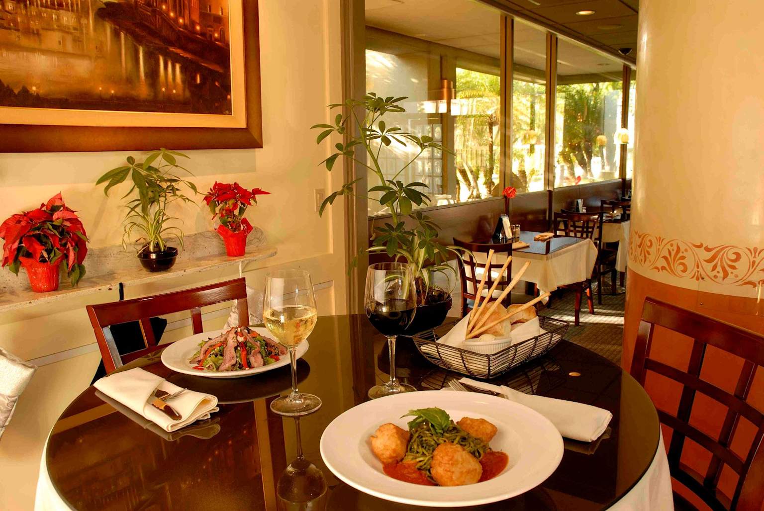 A set table with food and drinks inside SixtyTwo MarcKet Restaurant
