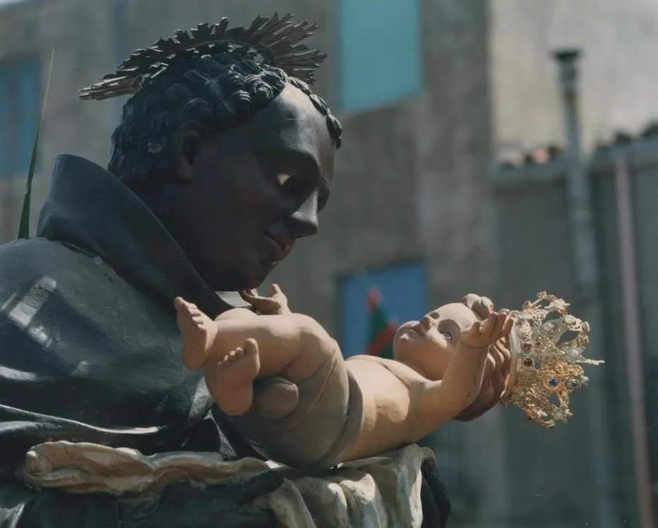 Statue of Saint Benedict of Palermo as a Franciscan friar holding the baby Jesus