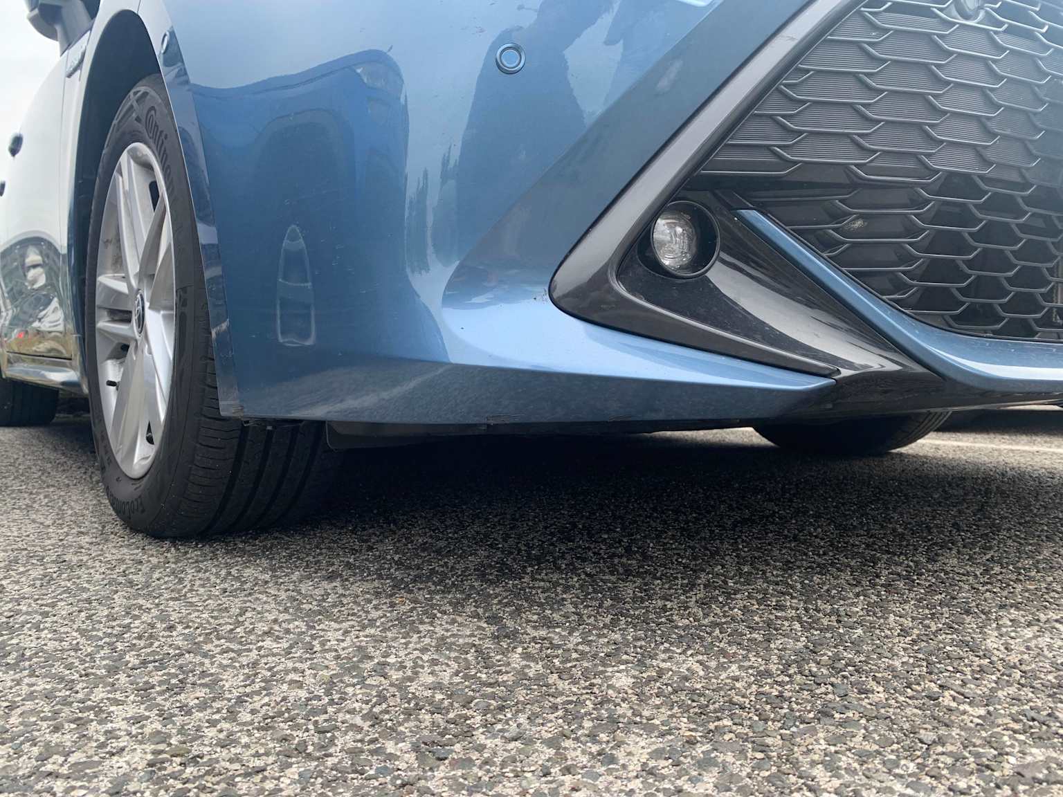 Minor damage to a car's front bumper