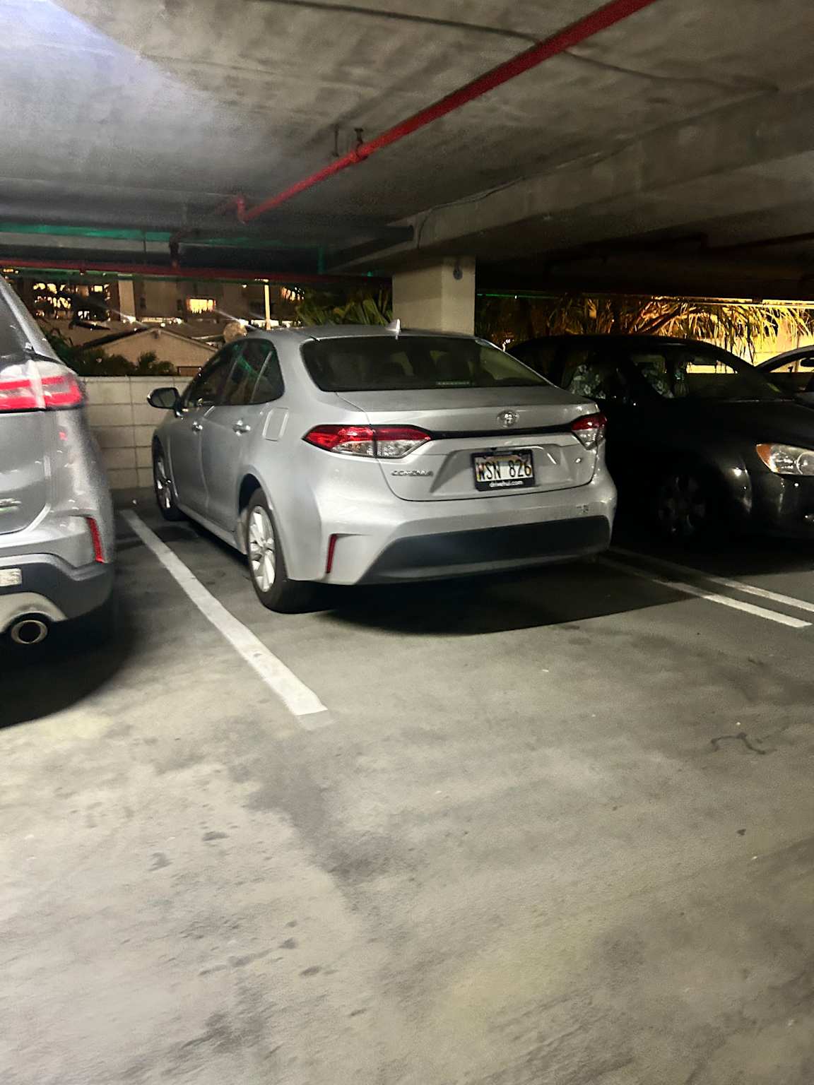 Rental car parked in a garage