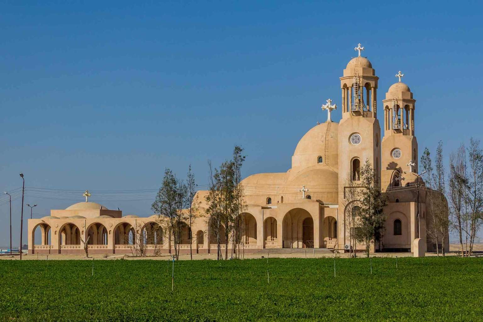 Monastery in Wadi Natrun, Egypt, featuring distinctive architecture and a desert oasis setting