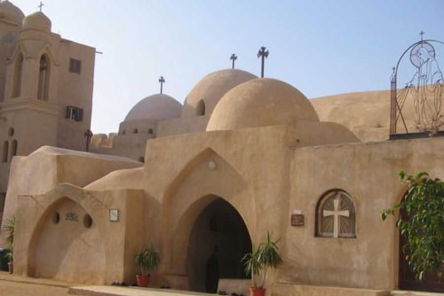 A Coptic monastery in Wadi El Natrun, Egypt, featuring rounded domes and arched doorways