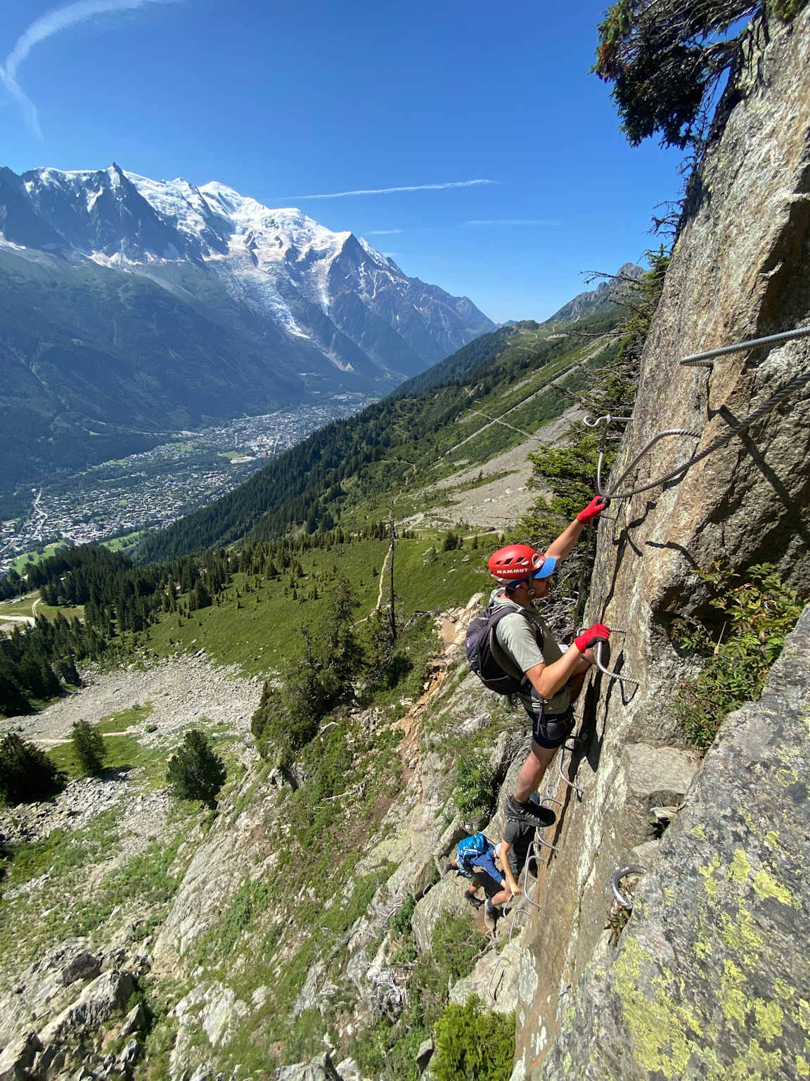 A climber ascends a via ferrata in Chamonix, France