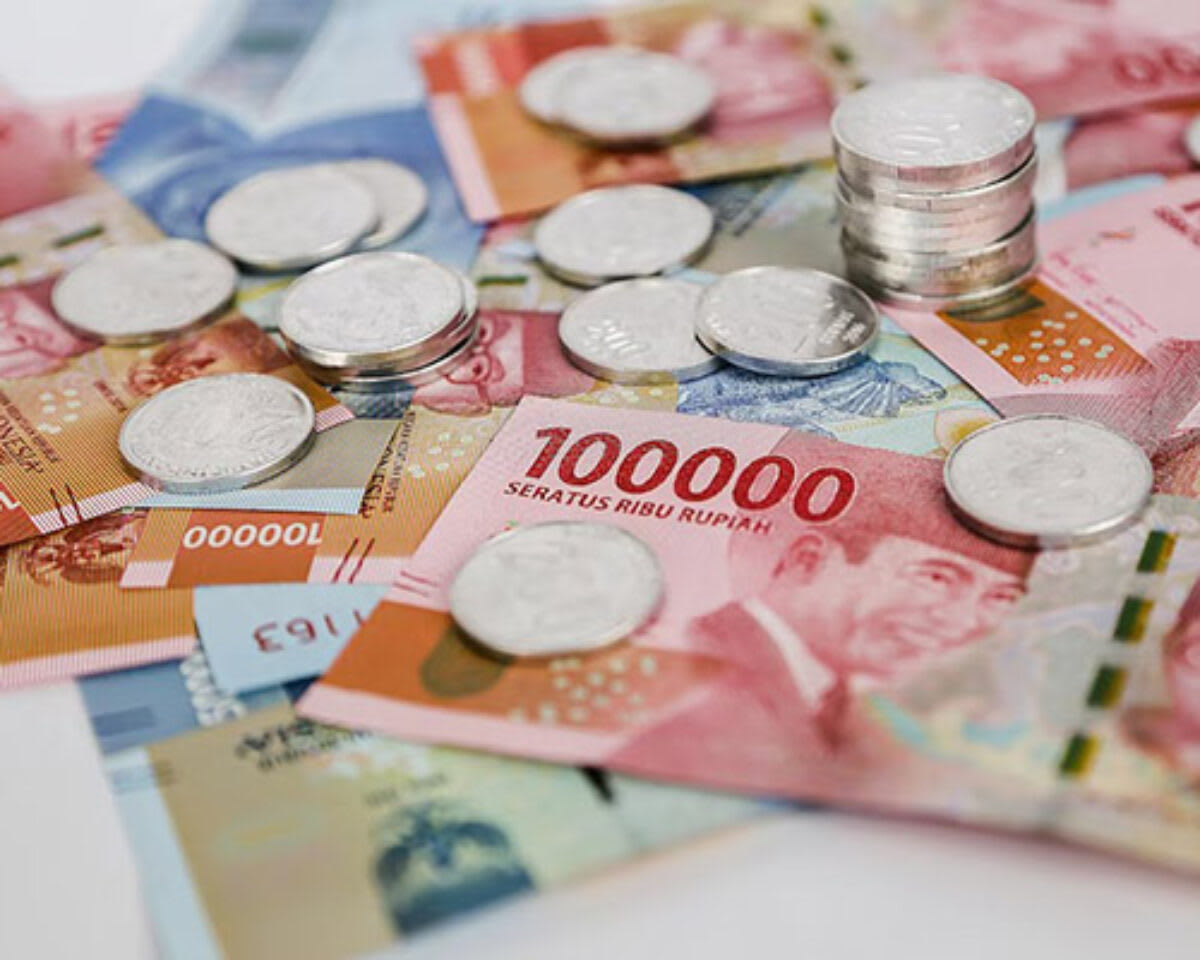 An assortment of Indonesian Rupiah banknotes and coins.