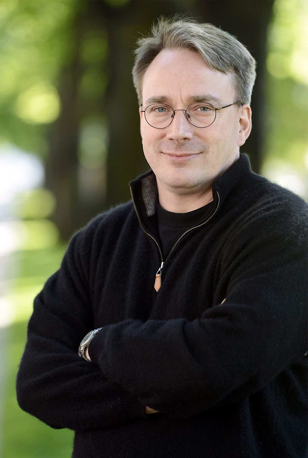 Portrait of Linus Torvalds, the creator of Linux, outdoors with a natural background.