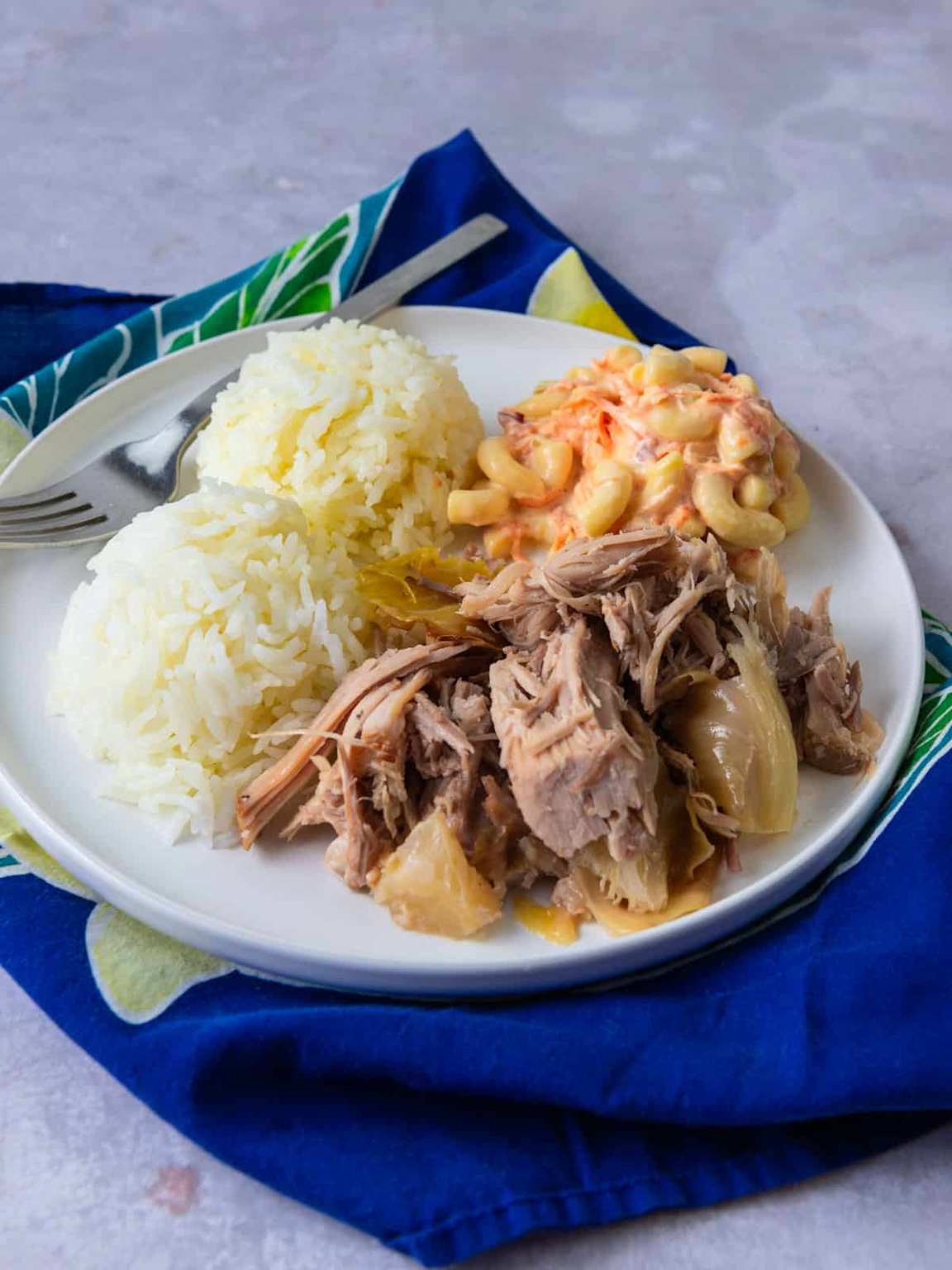 A classic Hawaiian plate lunch with kalua pig, rice, and macaroni salad
