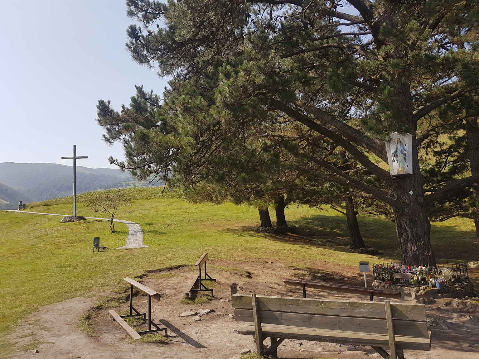 View of the Shrine at Garabandal, Spain, showing the cross and pine trees