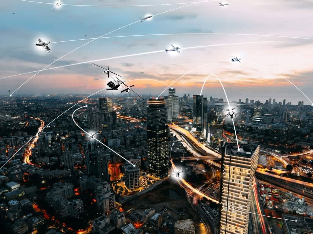A futuristic cityscape envisions interconnected urban air mobility
