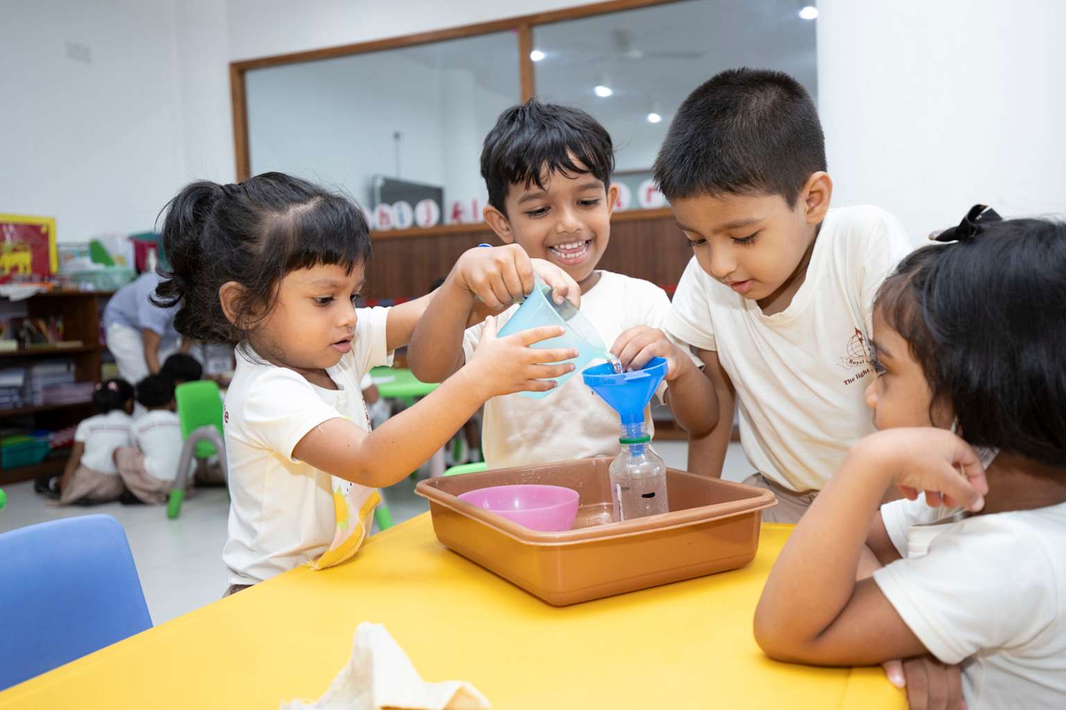 Children conduct a science experiment at Royal Institute in Sri Lanka