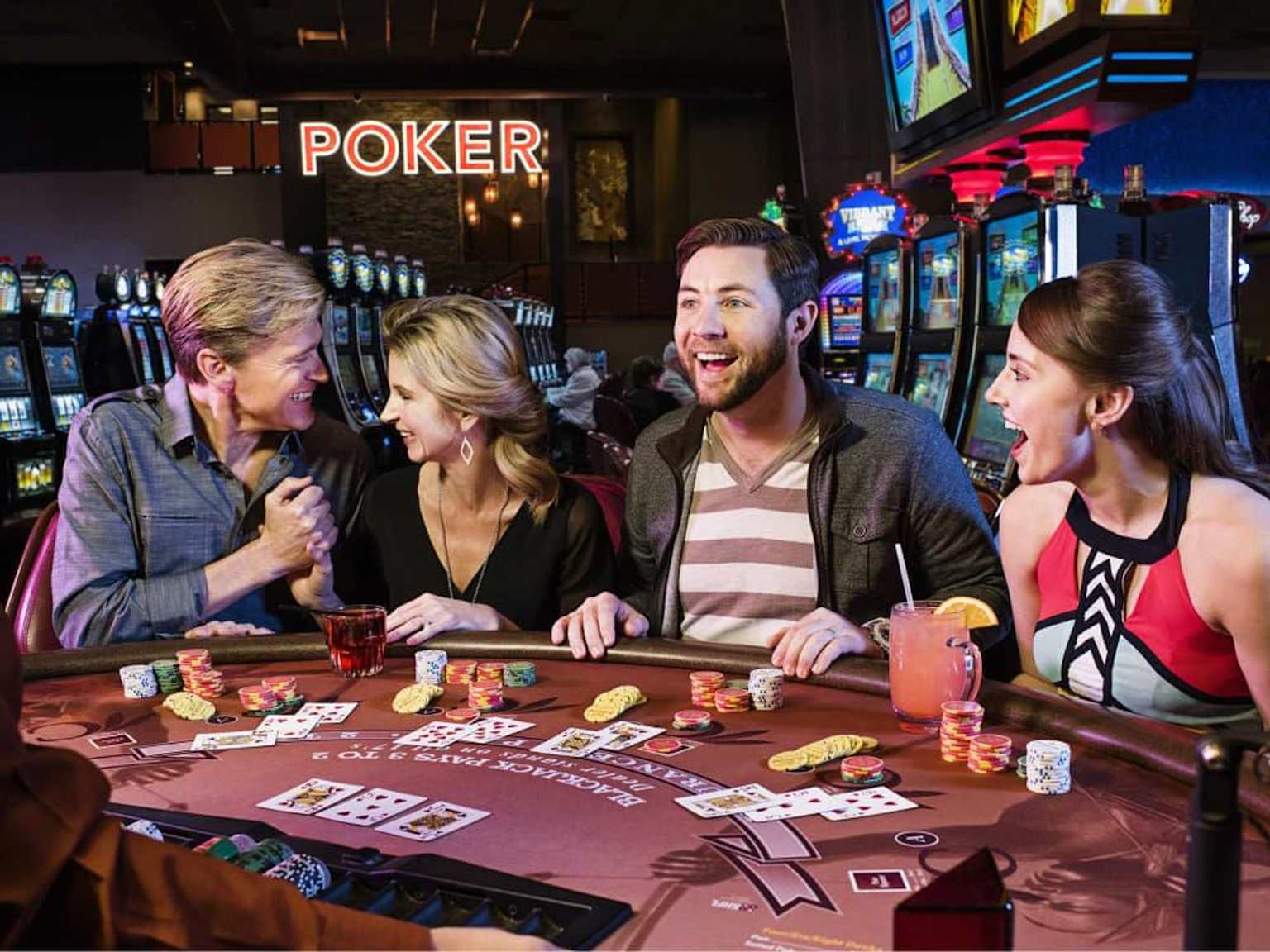 People enjoying a game of blackjack at a casino